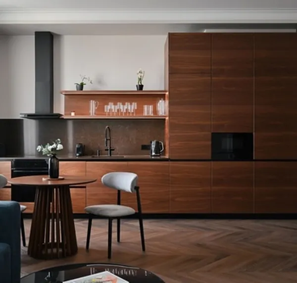 Apartment kitchen in walnut veneer with a dining table